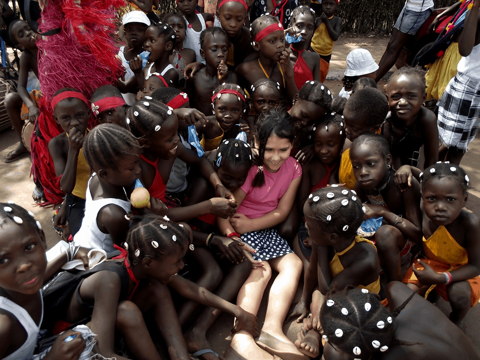 Francisca at a Carnival in Guinea Bissau with local school children.